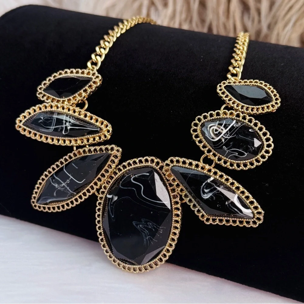 Goldtone and black accident statement, necklace